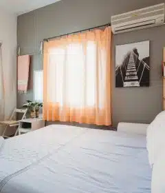 white bedspread inside room